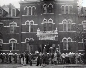 Workers gather outside the old St. Mary's Hospital prior to the start of the move